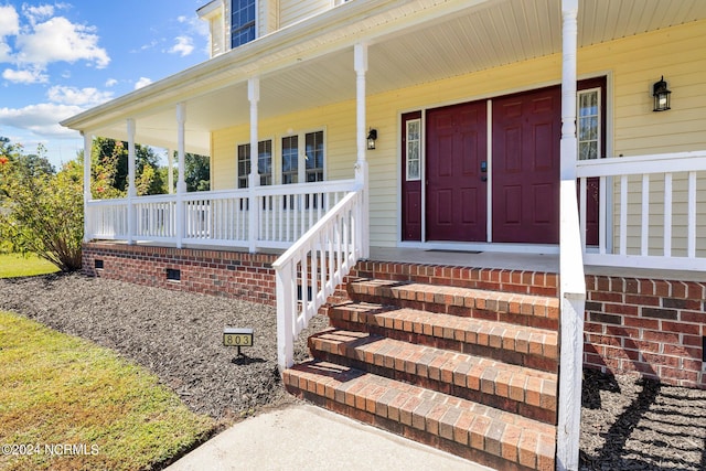 entrance to property with covered porch