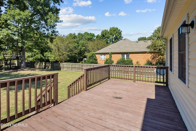 wooden terrace with a yard