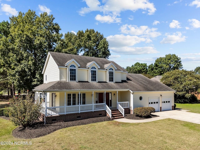 farmhouse inspired home featuring a front yard, a garage, and a porch