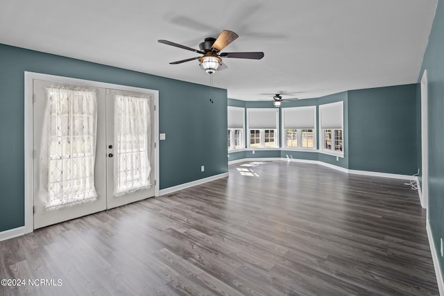 unfurnished living room with ceiling fan, hardwood / wood-style flooring, and french doors