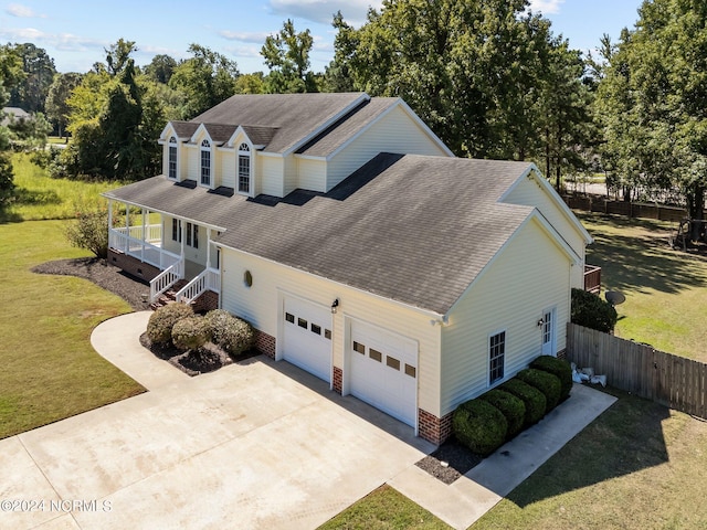 view of front of property with a garage and a front lawn