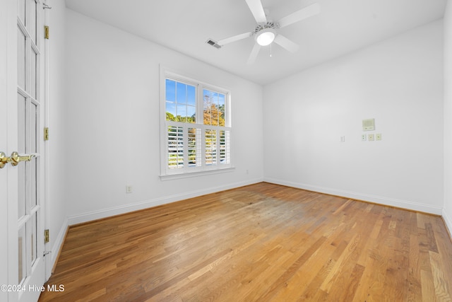 unfurnished room featuring ceiling fan and light hardwood / wood-style floors