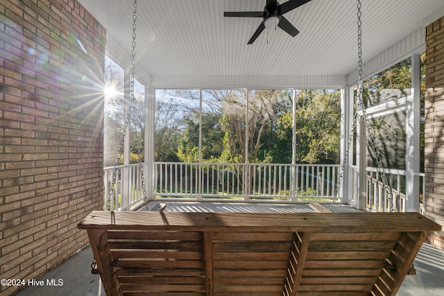 sunroom with ceiling fan and a wealth of natural light