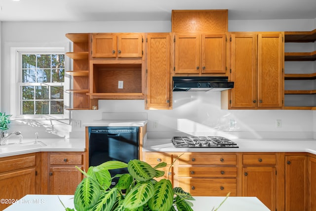 kitchen with stainless steel gas stovetop, dishwasher, decorative backsplash, and sink