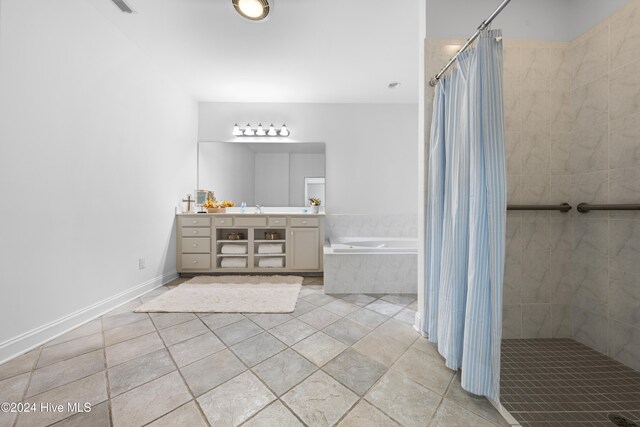 bathroom with separate shower and tub and vanity