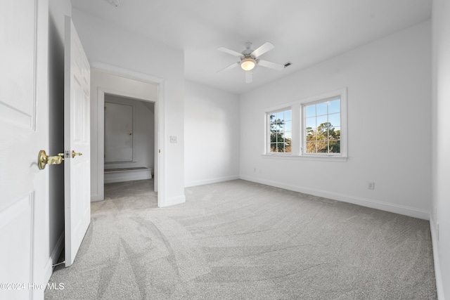 unfurnished bedroom with ceiling fan and light carpet