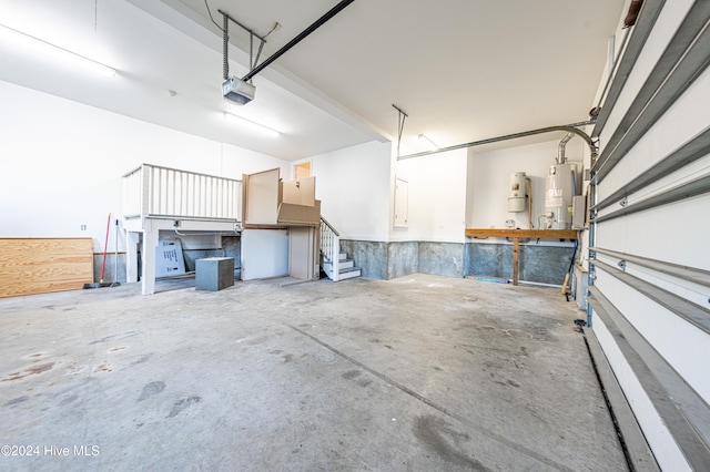 garage featuring gas water heater and a garage door opener