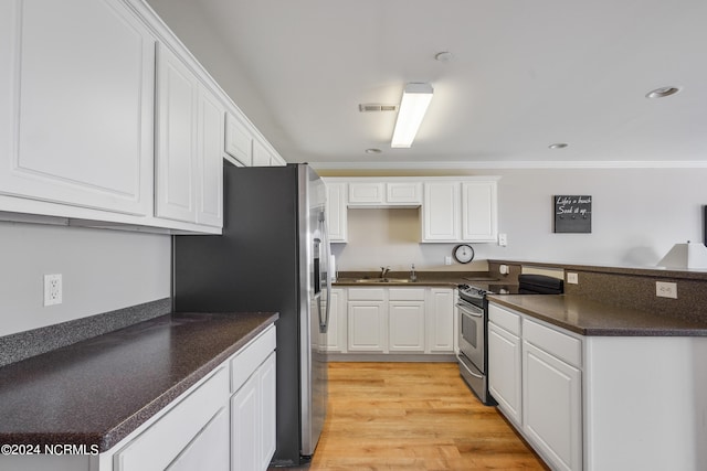 kitchen featuring light wood-type flooring, ornamental molding, stainless steel appliances, sink, and white cabinetry