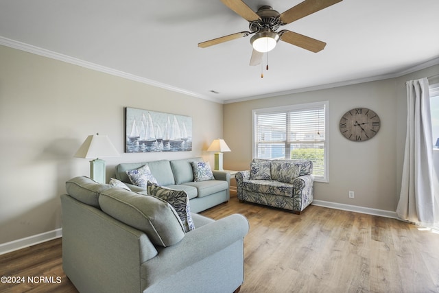 living room with crown molding, light hardwood / wood-style flooring, and ceiling fan