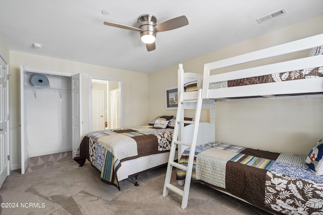 bedroom featuring light carpet, a closet, and ceiling fan