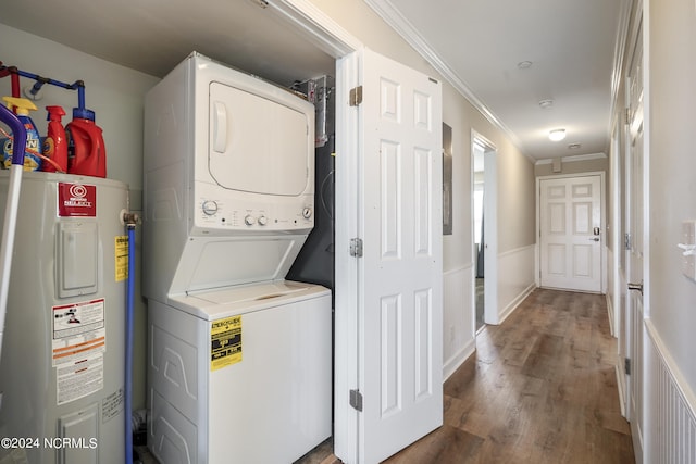 laundry room featuring hardwood / wood-style flooring, crown molding, stacked washer and clothes dryer, and water heater