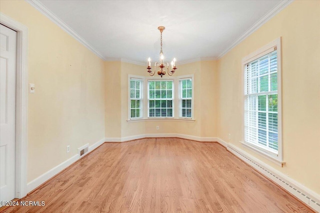 unfurnished room with light hardwood / wood-style flooring, a chandelier, and a wealth of natural light