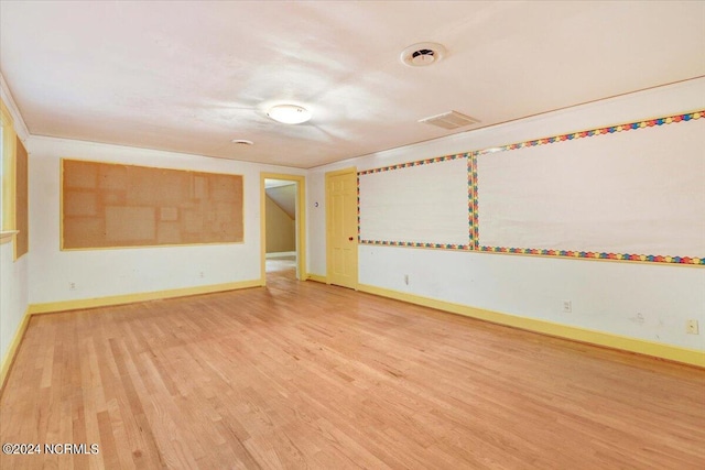 unfurnished room with hardwood / wood-style floors