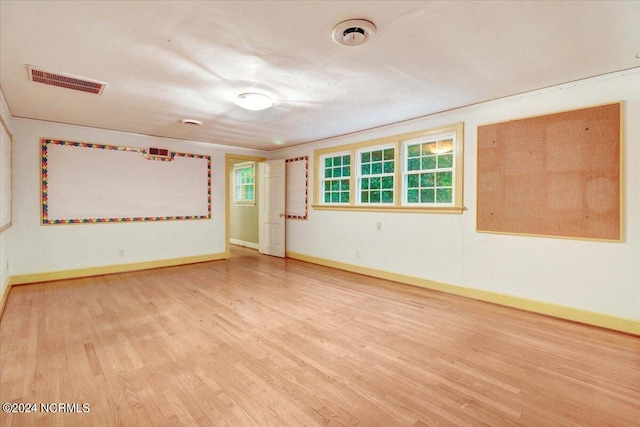 unfurnished room featuring wood-type flooring