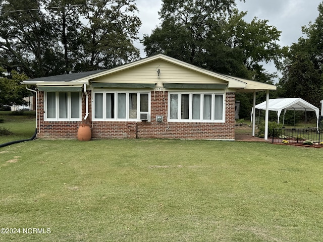 exterior space with a gazebo and a front yard