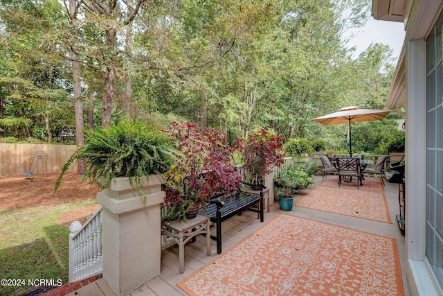 view of patio with fence and outdoor dining area