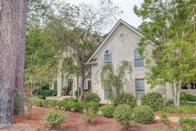view of front of house featuring stucco siding