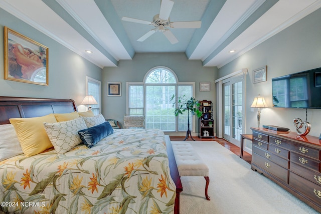 bedroom with beam ceiling, ceiling fan, french doors, ornamental molding, and hardwood / wood-style floors