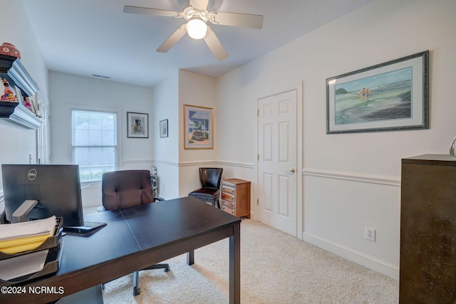 office area featuring baseboards, a ceiling fan, visible vents, and carpet floors