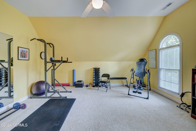 workout room featuring ceiling fan, lofted ceiling, and carpet flooring