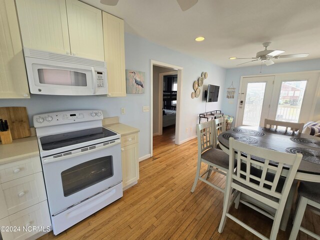 kitchen featuring white appliances, light wood-type flooring, and ceiling fan