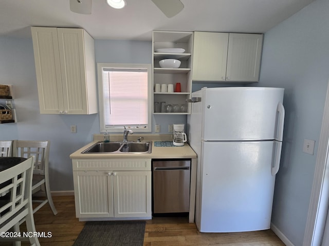 2712 Island Dr, North Topsail Beach, NC 28460 - kitchen featuring ceiling fan, freestanding refrigerator, light wood-type flooring, dishwasher, and a sink