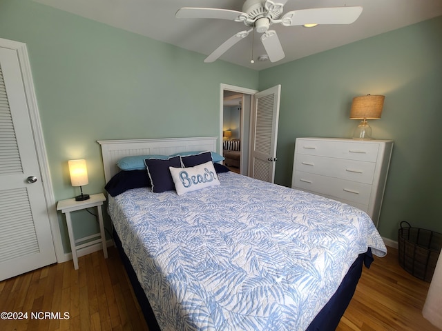 2712 Island Dr, North Topsail Beach, NC 28460 - bedroom with baseboards, a ceiling fan, and wood finished floors