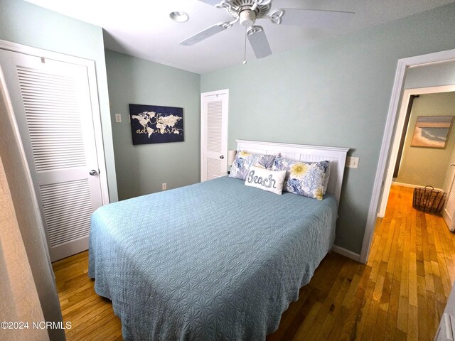 bedroom with ceiling fan, a closet, and hardwood / wood-style floors