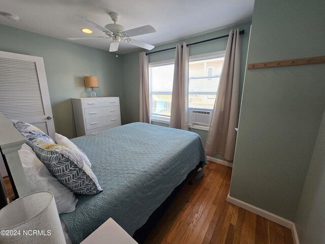 bedroom with ceiling fan and hardwood / wood-style floors