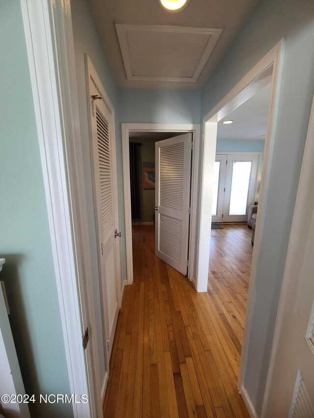 hall with light hardwood / wood-style flooring