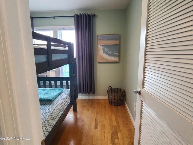 unfurnished bedroom with hardwood / wood-style floors