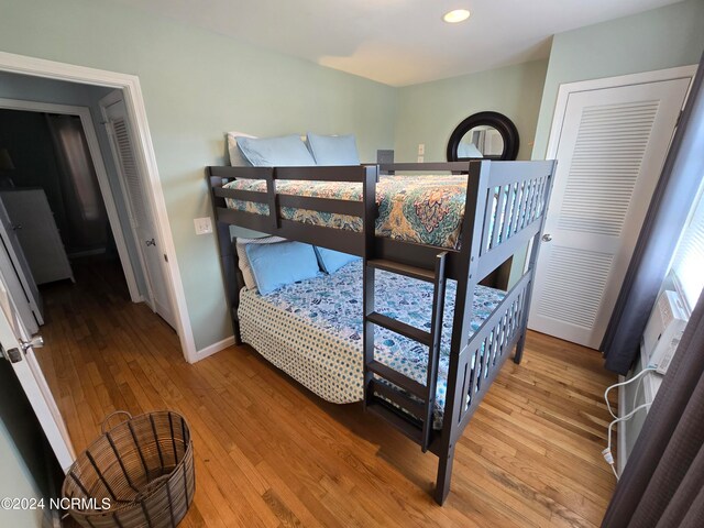 bedroom with a closet and wood-type flooring