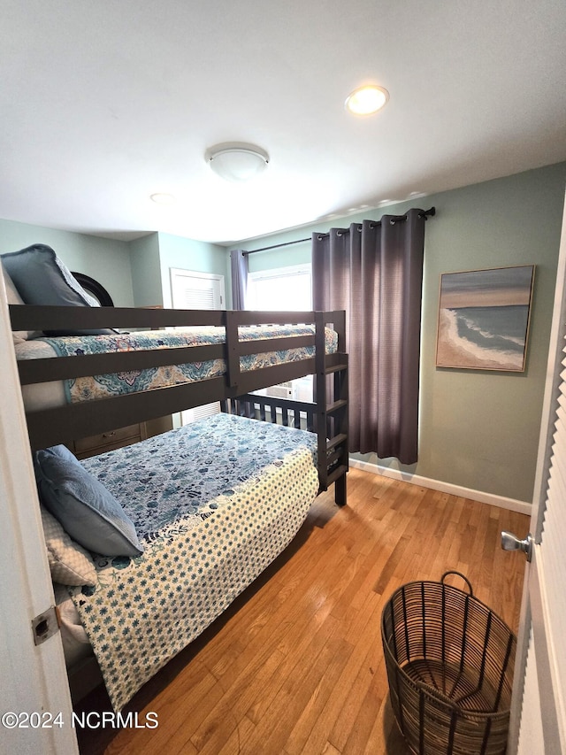 2712 Island Dr, North Topsail Beach, NC 28460 - bedroom featuring baseboards, recessed lighting, and hardwood / wood-style floors