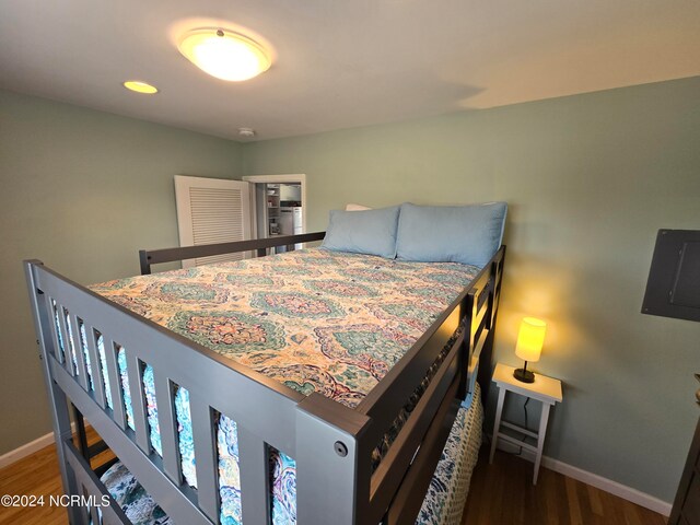 bedroom featuring dark wood-type flooring