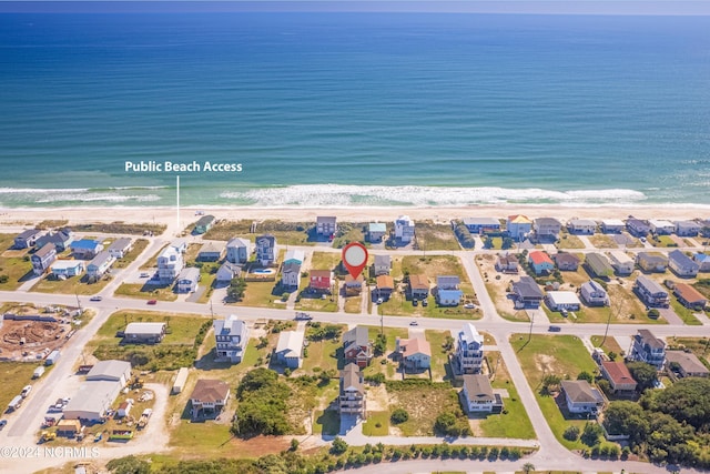 aerial view featuring a beach view and a water view