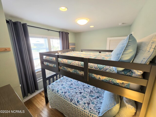 bedroom with wood-type flooring