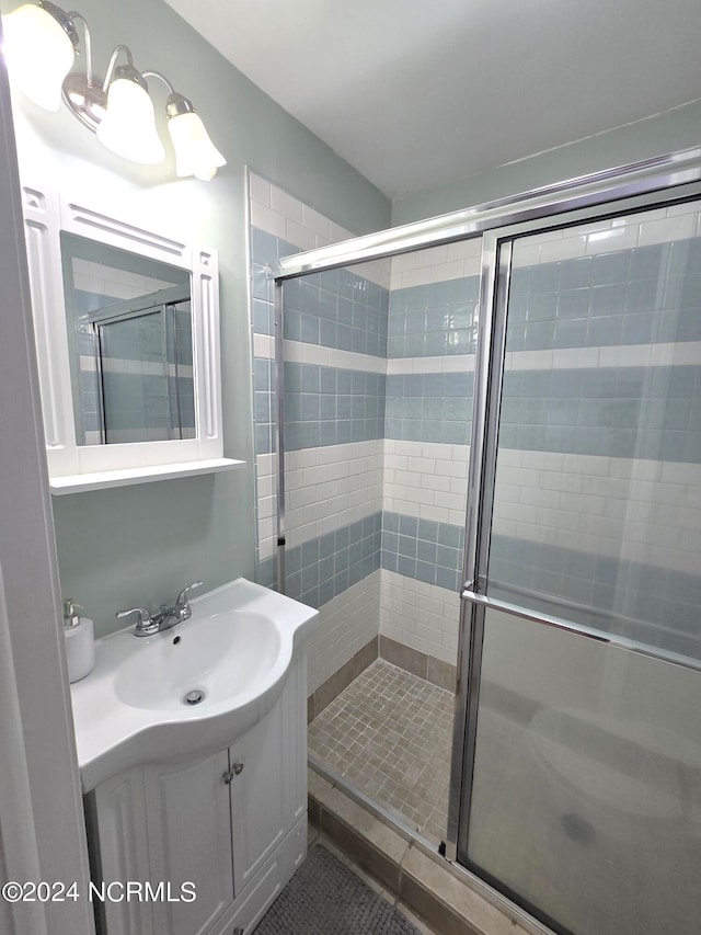 2712 Island Dr, North Topsail Beach, NC 28460 - bathroom with a shower stall and vanity