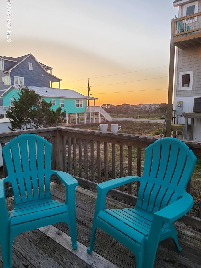 2712 Island Dr, North Topsail Beach, NC 28460 - wooden terrace featuring central air condition unit
