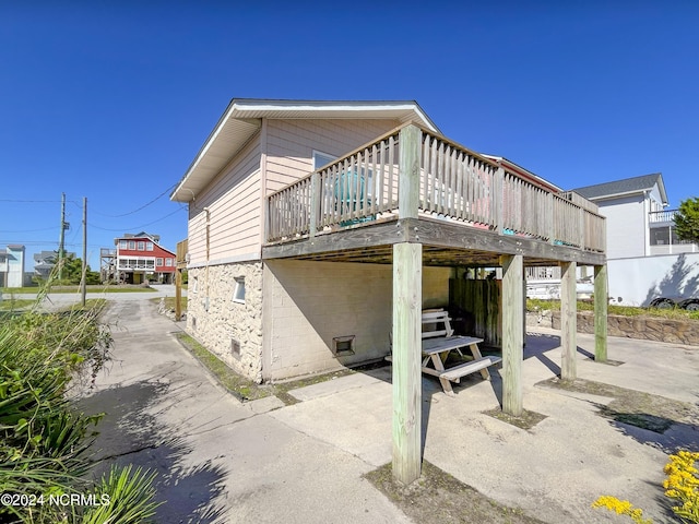 2712 Island Dr, North Topsail Beach, NC 28460 - rear view of house featuring concrete block siding and a deck