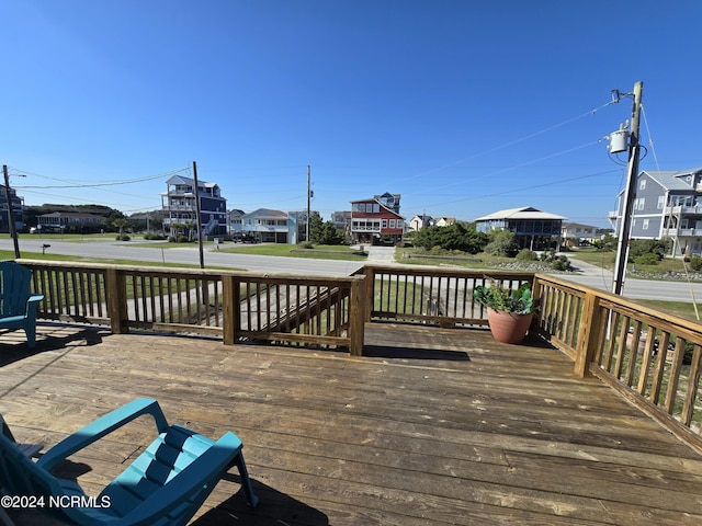 2712 Island Dr, North Topsail Beach, NC 28460 - wooden terrace featuring a residential view