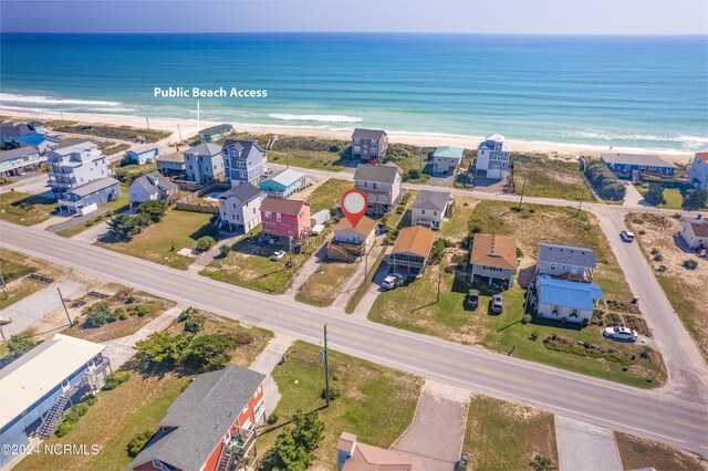 aerial view with a water view and a view of the beach