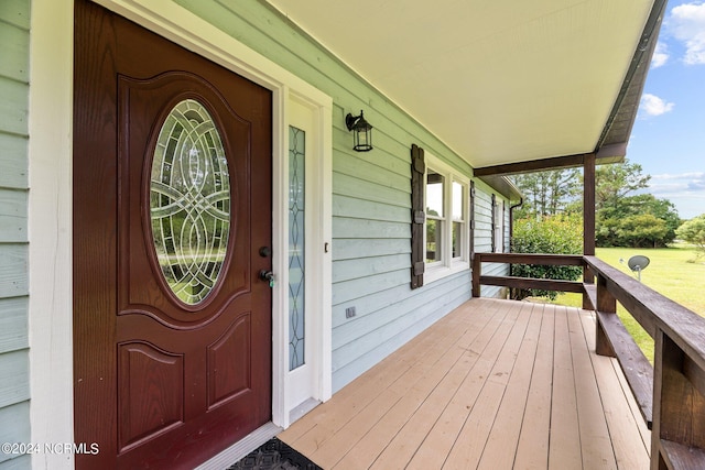 property entrance featuring covered porch