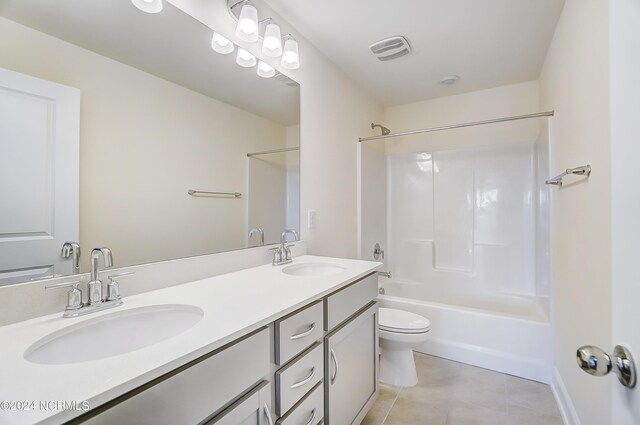 full bathroom with bathing tub / shower combination, vanity, toilet, and tile patterned floors