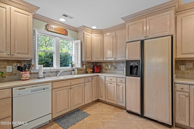 kitchen with paneled refrigerator, dishwasher, decorative backsplash, sink, and light tile patterned flooring