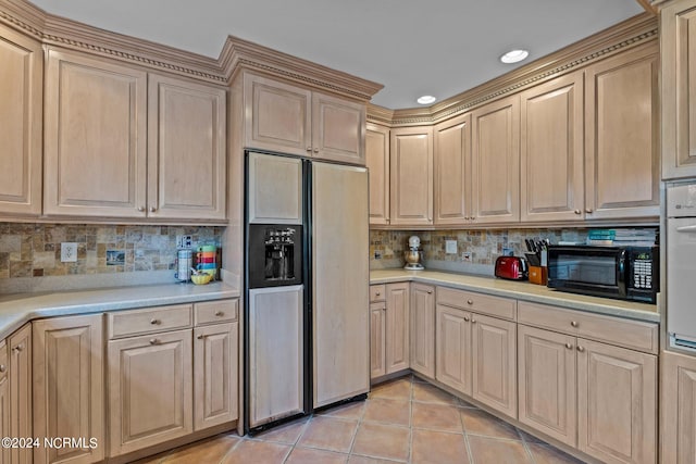 kitchen with paneled built in fridge, light brown cabinets, decorative backsplash, and light tile patterned floors