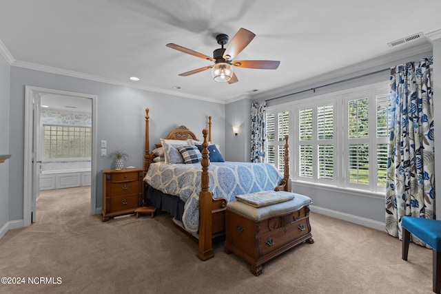 bedroom with ceiling fan, light colored carpet, ensuite bathroom, and crown molding