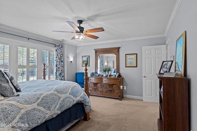 bedroom featuring ceiling fan, crown molding, and light carpet