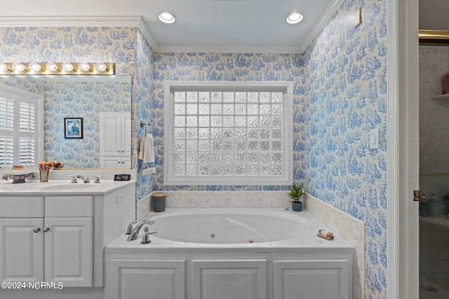 bathroom with vanity, ornamental molding, and a bathing tub