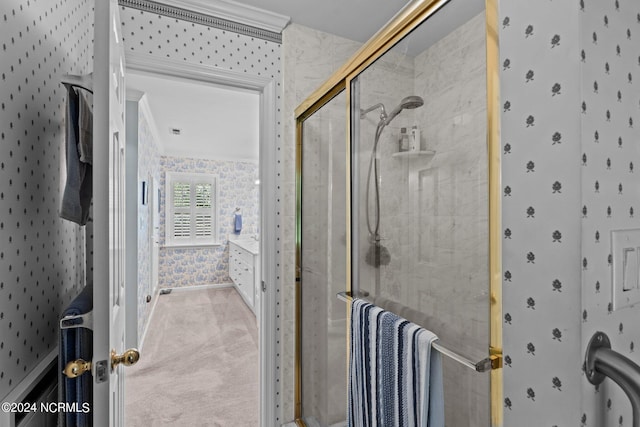 bathroom with crown molding and an enclosed shower