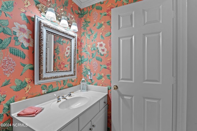 bathroom with vanity and ornamental molding